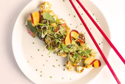 Image of a person practicing mindful eating, savoring each bite of a colorful, nutritious meal with focus and intention, highlighting the principles of mindfulness and gratitude in nourishing the body and mind.