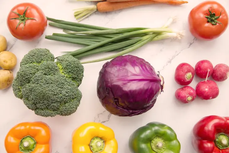 Close-up photo of a beautifully plated vegetarian meal, featuring a variety of vegetables, grains, and protein-rich plant foods, highlighting the delicious and nutritious nature of vegetarian cooking.